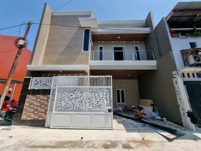 Rumah baru dalam proses finishing di perumahan Baturan